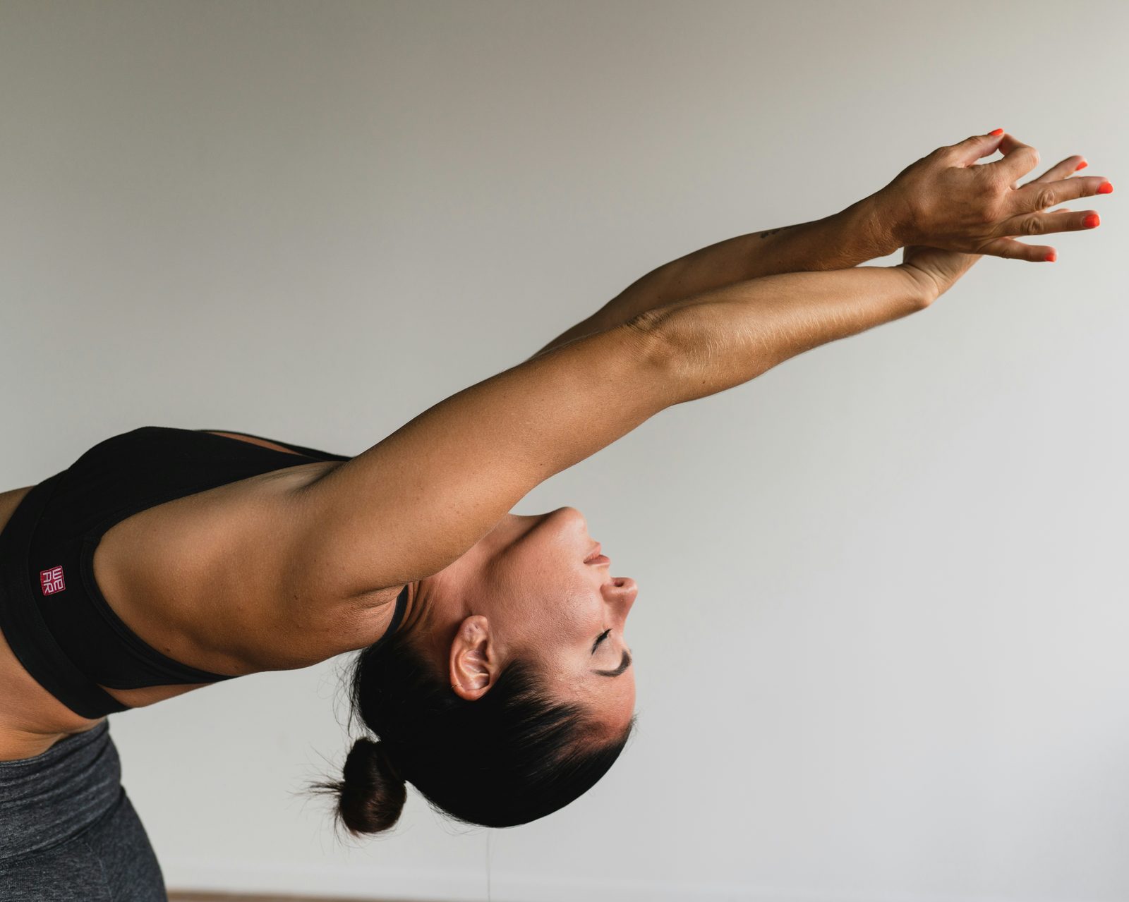 A woman in a deep backbend stretch