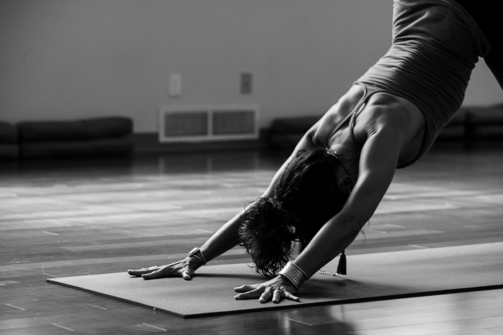 A person in downward dog in black and white